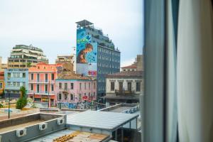 a view from a window of a city with buildings at Sani Deluxe Suites - Monastiraki Square - Brand New in Athens