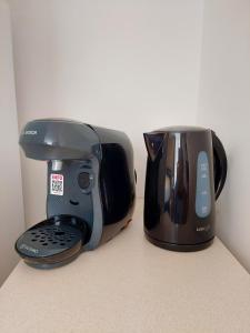 a toaster and a coffee maker sitting on a counter at ° Studio 1 - Lunéville centre ° in Lunéville