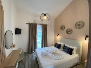 Postel nebo postele na pokoji v ubytování Christina Apartments
