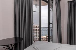 Voodi või voodid majutusasutuse Baba's Hotel & Spa toas