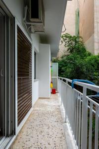 a walkway leading to a door of a building at Studio Apartment next to Alsos Ilision in Athens