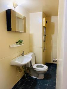 a small bathroom with a toilet and a sink at For rent condo popular T8 fl8 in Thung Si Kan