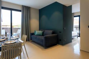 a living room with a couch and a table at Ollen apartments in Catania