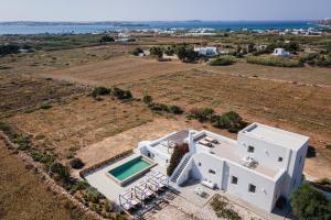 an aerial view of a villa with a swimming pool at Paros House Villa in Pounda