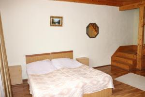 Voodi või voodid majutusasutuse Taoskari Hotel toas