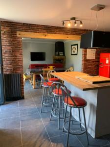 a kitchen and dining room with a table and chairs at Le 24’ Chrono in Le Mans