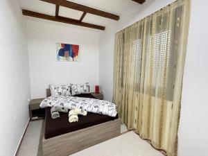 Кровать или кровати в номере Apartman Zlatić