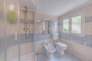 a bathroom with a toilet and a shower at Casa Otti by PortofinoHomes in Santa Margherita Ligure +76 photos