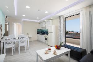 a living room with a kitchen and a dining room at Villa Jakov in Promajna