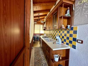 a kitchen with a sink and a counter top at Sea Pearl in Casteldaccia