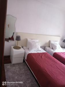 Łóżko lub łóżka w pokoju w obiekcie OPorto Apartment Antas
