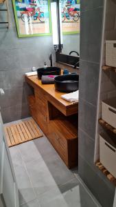 a bathroom with a sink and a mirror at Appartement Bilimbi Guadeloupe entre Sainte-Anne et Saint-François in Sainte-Anne