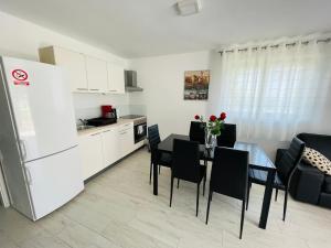 Kuchyň nebo kuchyňský kout v ubytování Apartment Paulina