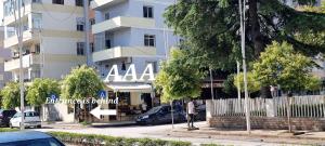 a man is standing in front of a building at Berat Apartment "AAA" in Berat