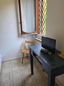 TV a/nebo společenská místnost v ubytování La casa di Nataly