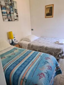 Postel nebo postele na pokoji v ubytování La casa di Nataly