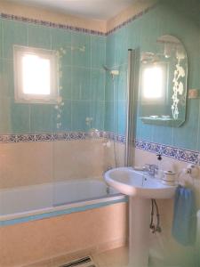 a bathroom with a sink and a bath tub and a sink at Mojacar Home with mountain views in Mojácar