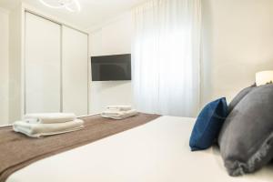 Posteľ alebo postele v izbe v ubytovaní Serene & spacious apartment - Center by REMS