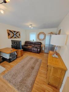 a living room with a couch and a table at Castle View Guest House in Harlech