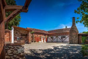 an exterior view of a house with a garage at Wellness B&B Winery Sontacchi in Kutjevo