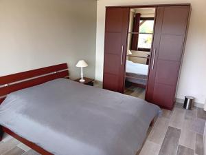 Кровать или кровати в номере Chez Nicolas