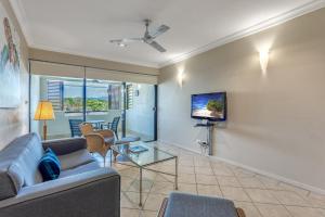 A television and/or entertainment centre at Magnificent 2 bed unit in heart of Port Douglas