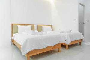 Postel nebo postele na pokoji v ubytování S1 Trang Hotel
