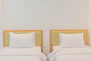 Postel nebo postele na pokoji v ubytování S1 Trang Hotel