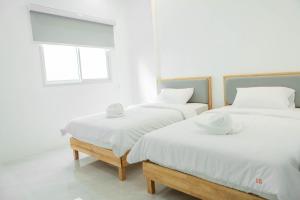 Postel nebo postele na pokoji v ubytování S1 Trang Hotel