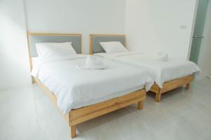 Postel nebo postele na pokoji v ubytování S1 Trang Hotel