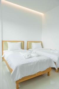 Postel nebo postele na pokoji v ubytování S1 Trang Hotel