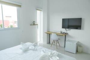 Postel nebo postele na pokoji v ubytování S1 Trang Hotel