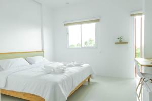 Postel nebo postele na pokoji v ubytování S1 Trang Hotel