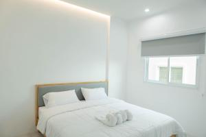 Postel nebo postele na pokoji v ubytování S1 Trang Hotel