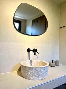 a bathroom sink with a faucet and a mirror at Palma Seaside Villa 3 in Sarti +65 photos