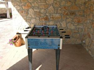a chess board in front of a stone wall at Appartamenti In Villa Elena in Grutti