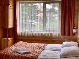 Postel nebo postele na pokoji v ubytování Vila Katerina