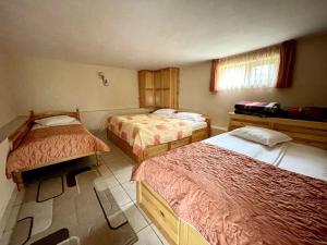 Postel nebo postele na pokoji v ubytování Vila Katerina