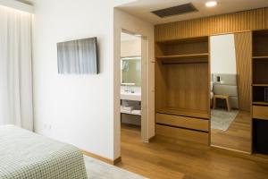 Ένα ή περισσότερα κρεβάτια σε δωμάτιο στο Hotel Lara