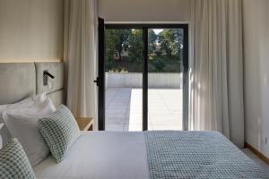 Ένα ή περισσότερα κρεβάτια σε δωμάτιο στο Hotel Lara