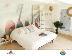 a bedroom with a large white bed in a room at Little America - Appart Hôtel 3km Futuroscope in Jaunay-Marigny +62 photos