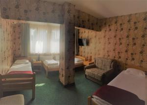 Letto o letti in una camera di Hotel Slodes