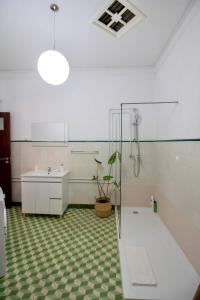 a bathroom with a sink and a toilet in a room at Apartamento do Arquinho I - by VinteOito in Amarante +32 photos