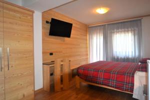 Postel nebo postele na pokoji v ubytování Hotel La Montanina