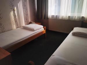 Letto o letti in una camera di Hotel Slodes