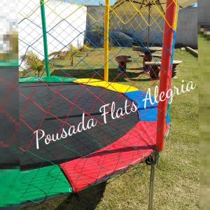 a colorful kite on a trampoline at Pousada Flats Alegria in Olímpia