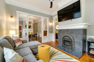 a living room with a couch and a fireplace at Wilmington Vacation Rental Close to Riverwalk! in Wilmington
