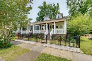 a house with a gate in front of it at Wilmington Vacation Rental Close to Riverwalk! in Wilmington
