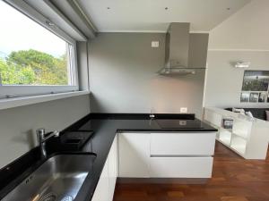 a kitchen with a sink and a window at La Dolce Vita Arco in Arco +47 photos
