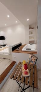 a room with a kitchen with a bed and a table at BARBARA Classy Apartments 103 in Siracusa